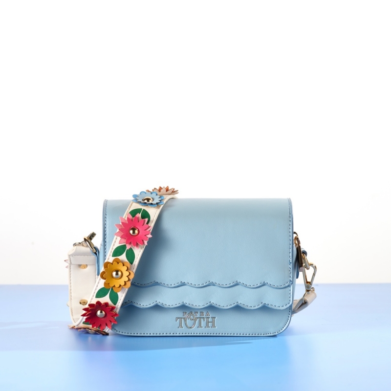 Blue handbag with a strap with flowers